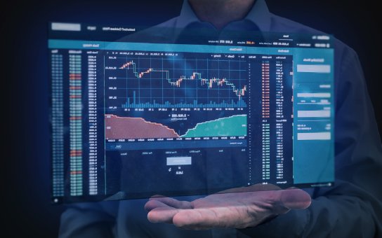Trader monitoring live markets on screen