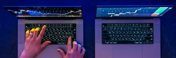 Trader following signals on a laptop