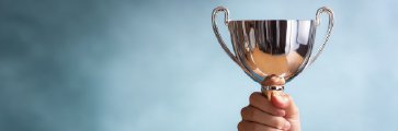 Gold trophy representing trading contest prizes